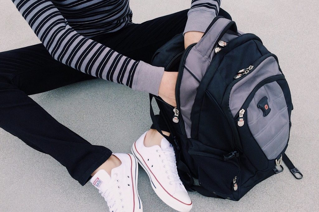 Girl packing a backpack