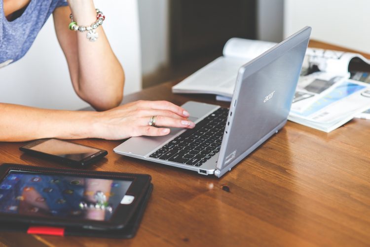 Woman with computer and tablet