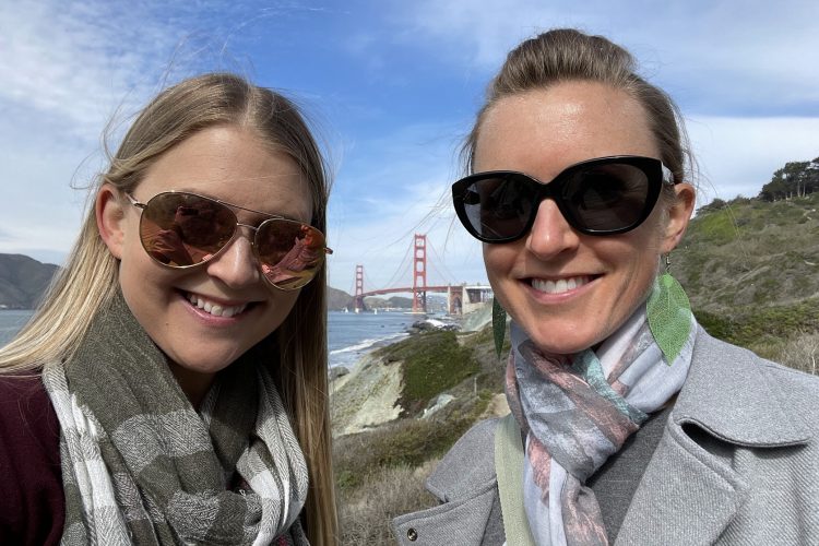 Two women in front of Golden Gate Bridge